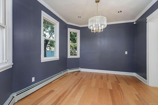 unfurnished room featuring ornamental molding, light hardwood / wood-style floors, a chandelier, and baseboard heating