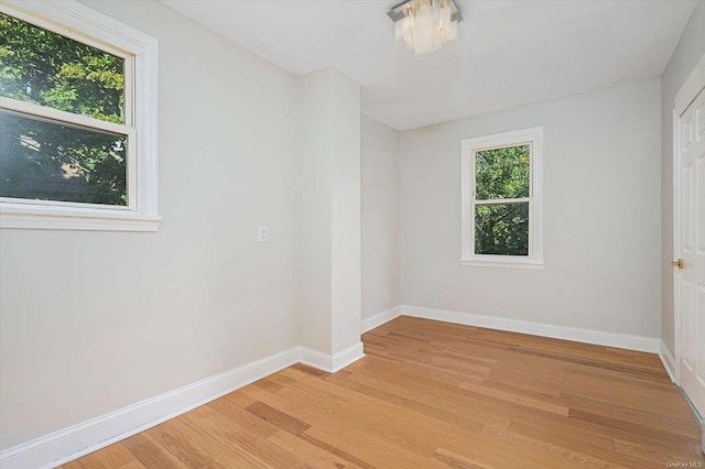 unfurnished room featuring light wood-type flooring