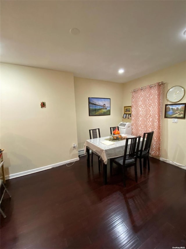 dining room featuring dark hardwood / wood-style flooring and washer / dryer