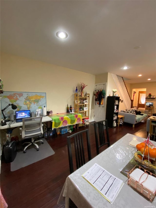 dining room with dark hardwood / wood-style flooring