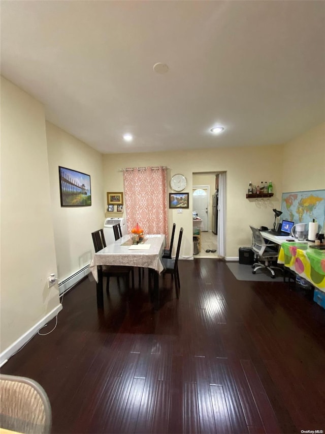 dining area with a baseboard radiator and hardwood / wood-style flooring