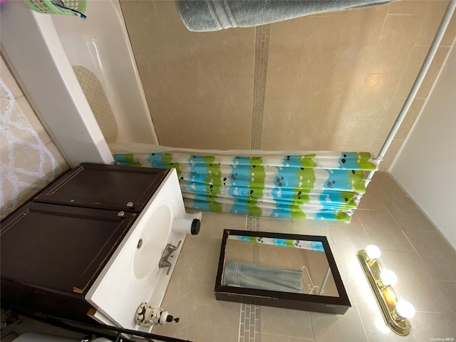 bathroom with tile patterned floors