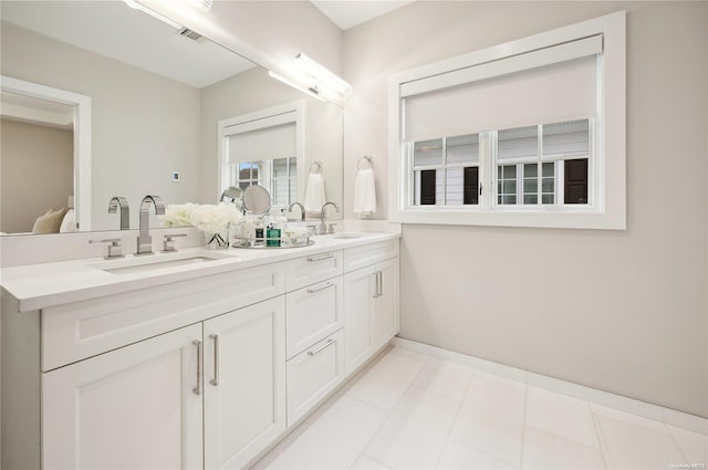 bathroom featuring tile patterned flooring and vanity