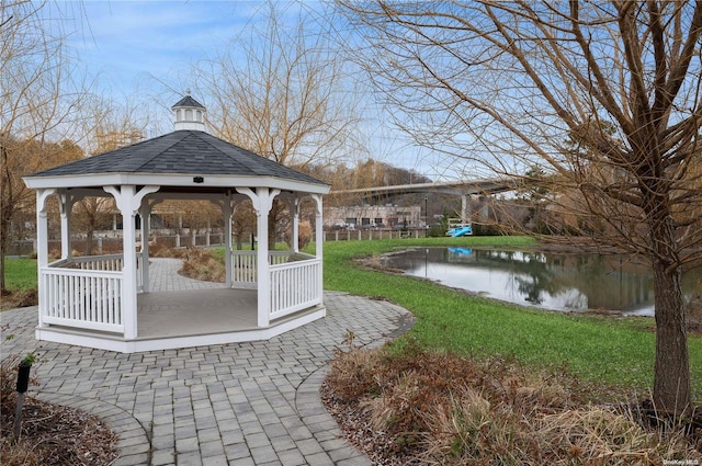 exterior space featuring a gazebo and a water view