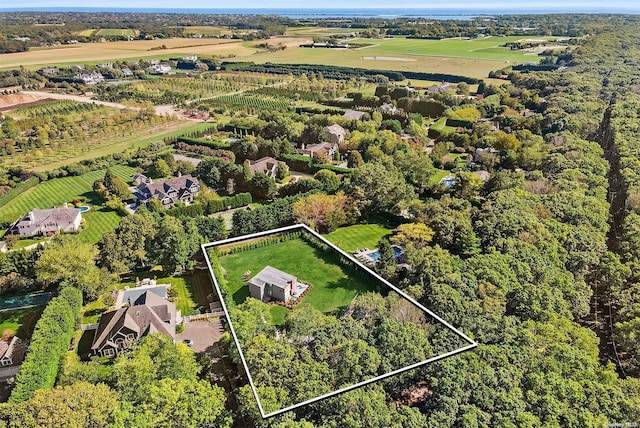 birds eye view of property with a rural view