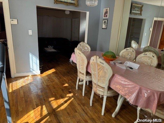 dining space featuring dark hardwood / wood-style floors