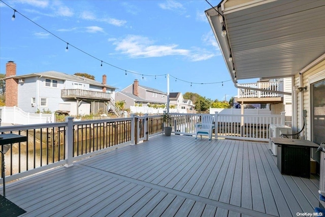 wooden deck with a water view