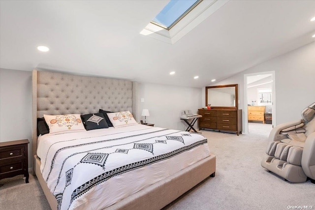 carpeted bedroom with vaulted ceiling with skylight