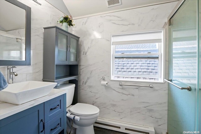 bathroom with vanity, a baseboard heating unit, toilet, tile walls, and an enclosed shower