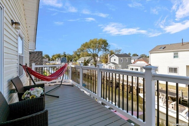 wooden deck with a water view