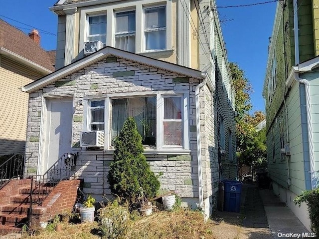 view of front of house featuring cooling unit