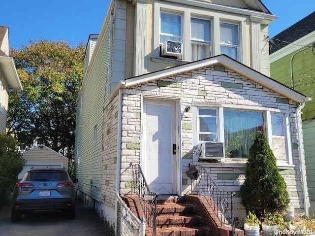 view of front of home featuring cooling unit