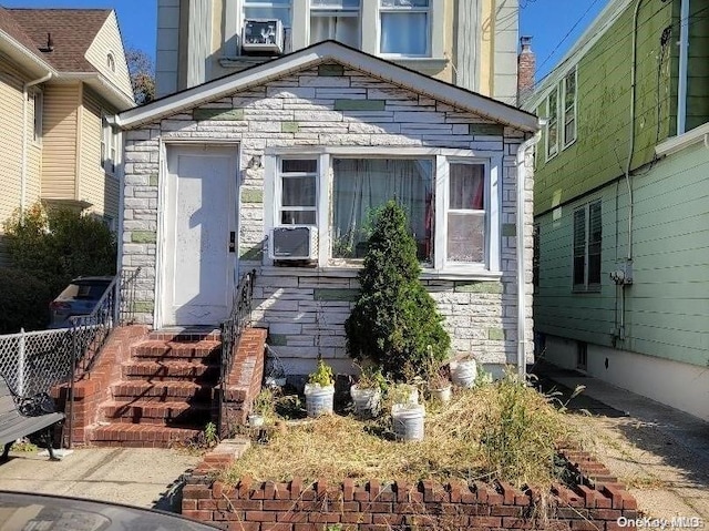 view of front of home featuring cooling unit