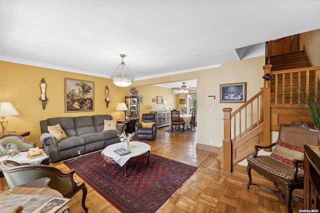 living room featuring ceiling fan and light parquet floors