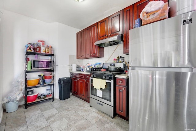 kitchen featuring decorative backsplash and stainless steel appliances