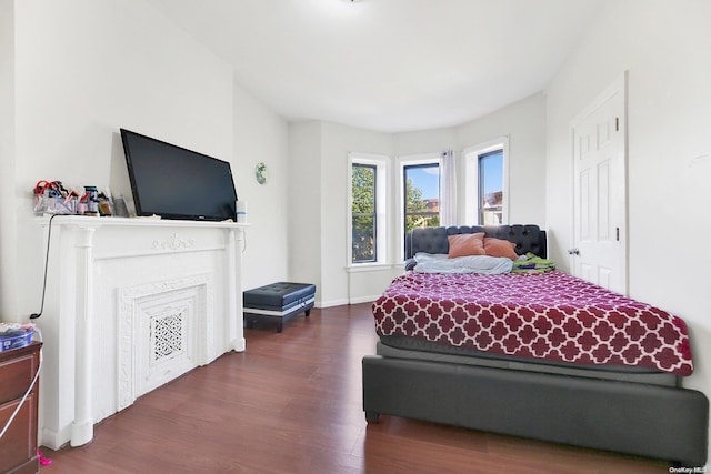 bedroom featuring dark hardwood / wood-style flooring