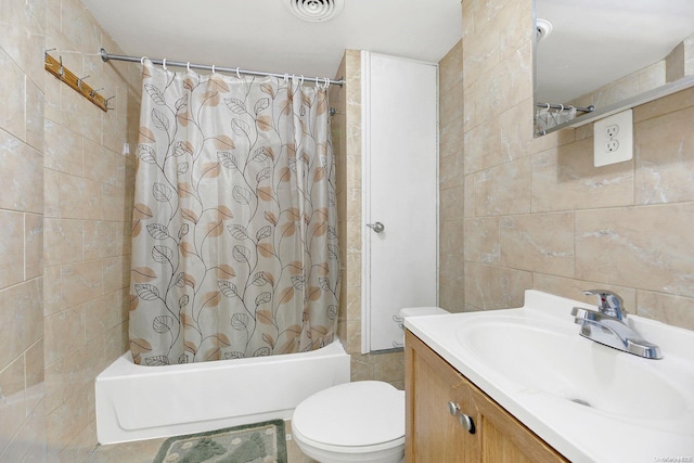 full bathroom featuring vanity, toilet, tile walls, and shower / bath combo with shower curtain