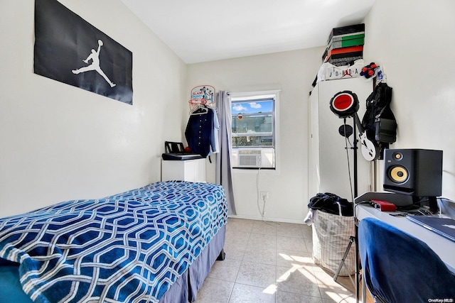 bedroom with cooling unit and light tile patterned floors