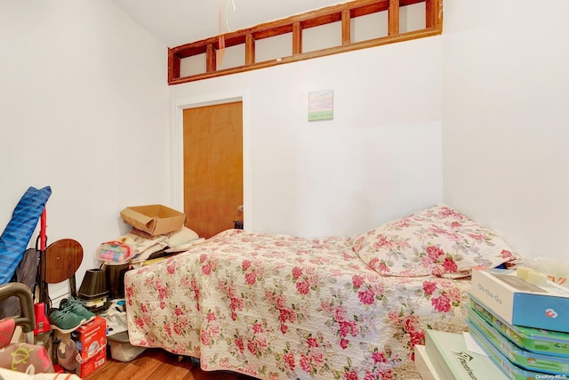 bedroom featuring hardwood / wood-style flooring