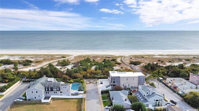 bird's eye view with a water view and a view of the beach