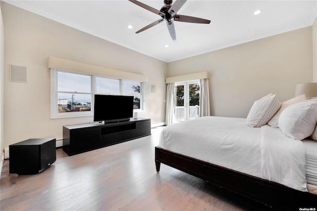 bedroom with wood-type flooring, a baseboard radiator, ceiling fan, and ornamental molding