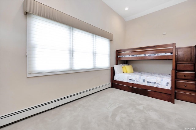 unfurnished bedroom featuring baseboard heating and light carpet