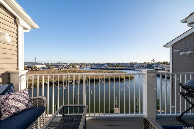 balcony featuring a water view