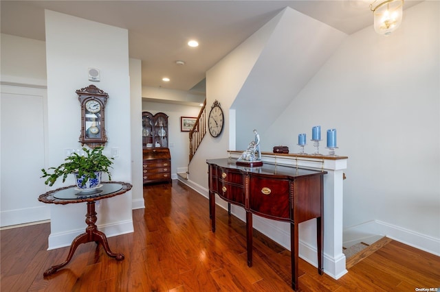 hallway with dark hardwood / wood-style flooring