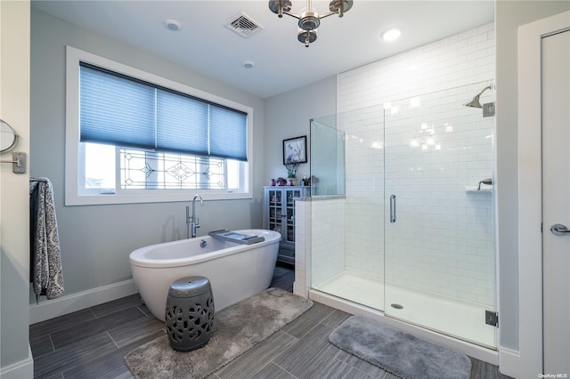 bathroom with separate shower and tub