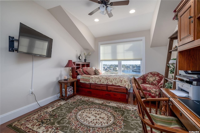 bedroom with light wood-type flooring, ceiling fan, and lofted ceiling