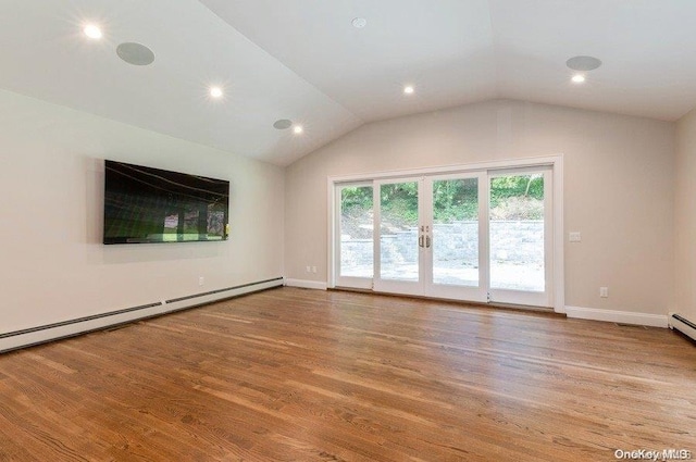 unfurnished living room with wood-type flooring, a baseboard radiator, and vaulted ceiling