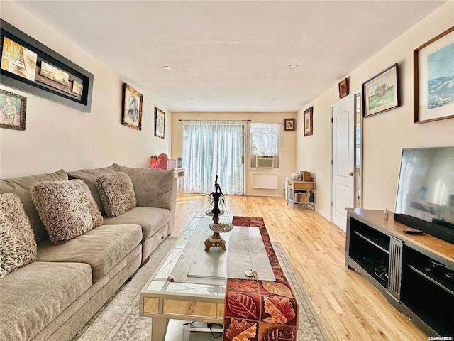 living room featuring light hardwood / wood-style flooring and cooling unit