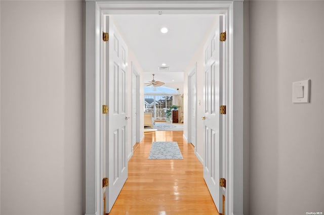 hallway with light wood-type flooring