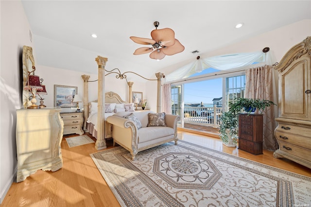 bedroom with access to outside, light hardwood / wood-style flooring, and ceiling fan