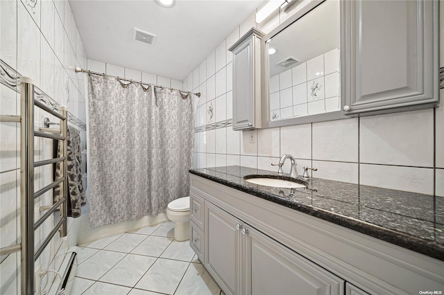 full bathroom featuring tile patterned flooring, backsplash, toilet, vanity, and tile walls