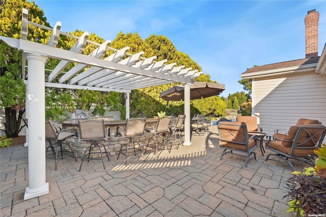 view of patio featuring a pergola and an outdoor bar