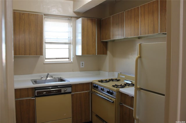 kitchen featuring white appliances and sink