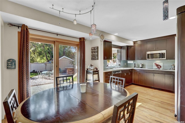 dining area featuring light hardwood / wood-style flooring and sink