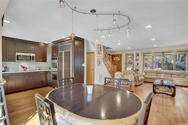 dining space with light hardwood / wood-style flooring