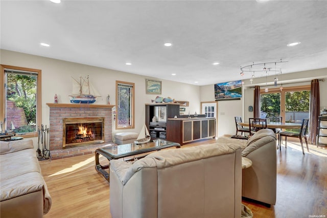 living room with a fireplace and light hardwood / wood-style floors