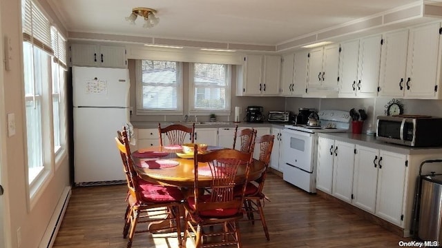 kitchen with white appliances, white cabinetry, plenty of natural light, and dark wood-type flooring