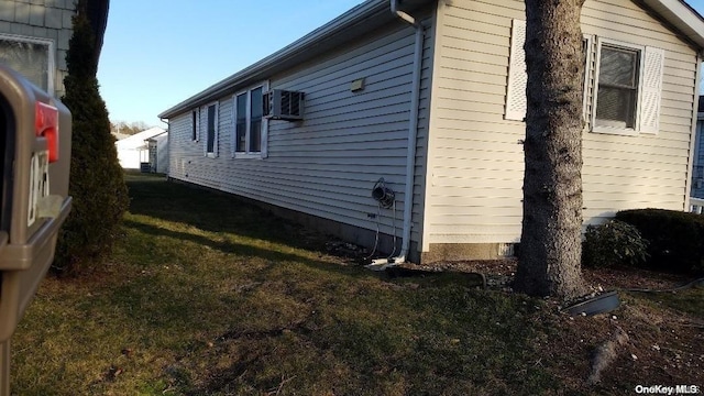 view of property exterior with a yard