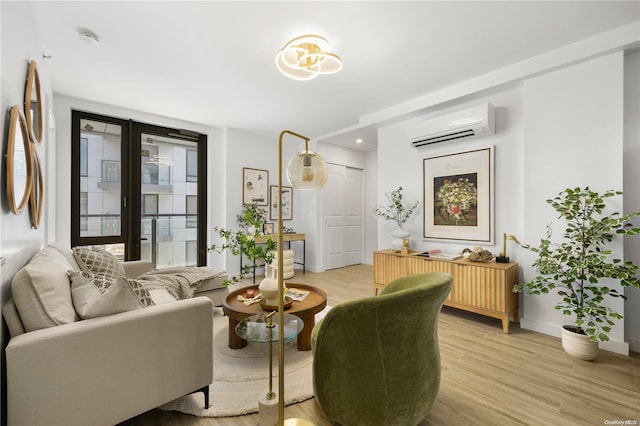 interior space with light hardwood / wood-style flooring and an AC wall unit