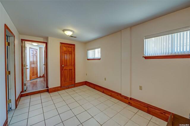 foyer featuring light tile patterned floors