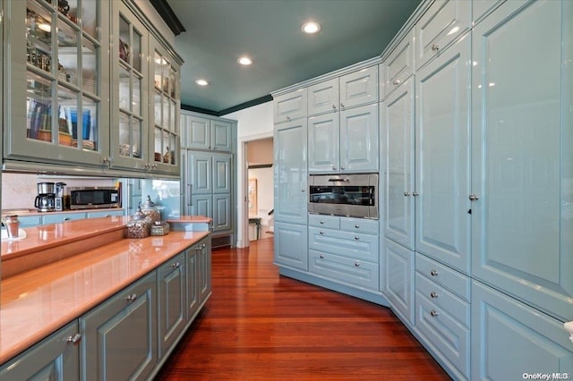 kitchen with tasteful backsplash, ornamental molding, dark hardwood / wood-style floors, and wood counters