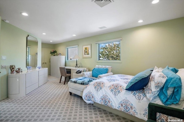 bedroom with light colored carpet