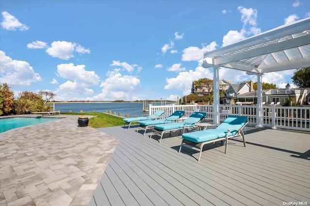 wooden terrace with a water view and a pergola