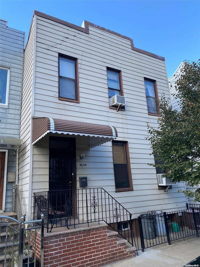 view of front facade featuring cooling unit