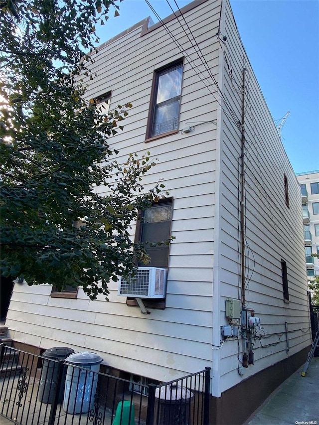 view of home's exterior with cooling unit