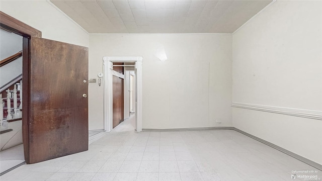 spare room featuring ornamental molding